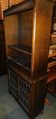 An Old Charm style glazed bookcase, together with another similar open bookcase. (2)