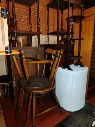 An oak cake stand, together with two Edwardian bedroom chairs and a Lloyd Loom linen basket. (4)