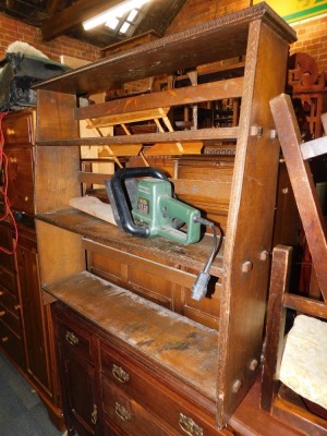 An oak telephone seat, together with a 20thC carved oak bookcase, hedge cutter and a wall rack. (4) WARNING! This lot contains untested or unsafe electrical items. It is supplied for scrap or re-conditioning only. TRADE ONLY