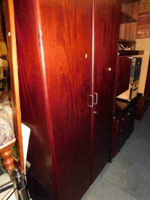 A mahogany effect office suite, comprising two desks, two filing chests, office cupboard and a similar cabinet. (6)