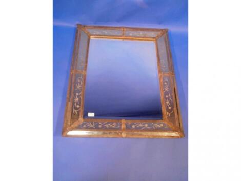 A rectangular etched decorative mirror