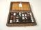 A wooden and leather cased domino set