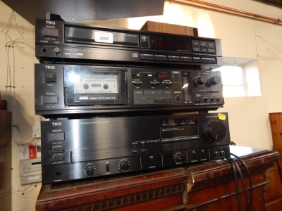 A Trio stereo integrated amplifier, KA660, a stereo cassette deck KX780, and a compact disc player DP-900.