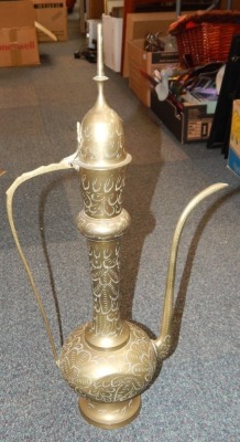 An Eastern brass coffee ewer.