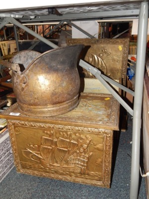 A group of brass fireside wares, to include coal bucket, magazine rack, fire stand, each with ship detailing, together with an additional coal bucket. (4)