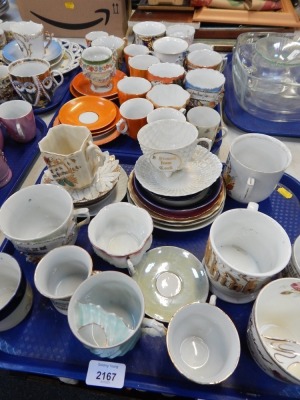 A group of cups and saucers, Victorian moustache cups, 'Present from' Cork, Scaraborough, etc. (2 trays)