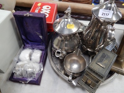 A group of silver plated and other wares, to include silver plated three piece serving set, a brass candlestick, model of The French Bridge, three advertising tins, etc. (a quantity)