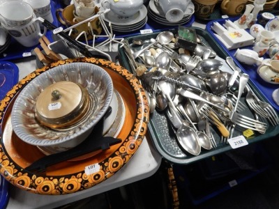 An orange lustre salad bowl, plate stands, dressing table jar, stoneware bowl, side plates, silver plated cutlery, etc. (2 trays)