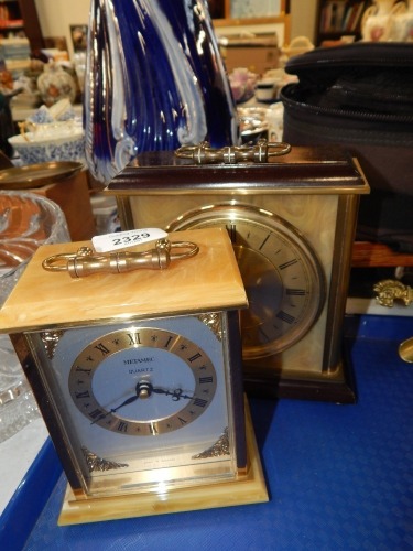 Two Metamec mantel clock, each with onyx effect detailing and brass dials.