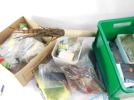 An assortment of fly dressers materials, to include packets of Marabou, Hackles. pheasant tails, dubbing, etc. (1 crate 1 box)