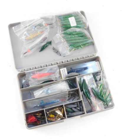 A small fishing tackle box, and an assortment of Devon Minnows, etc, to include lead weights, and spinners. (1 tray)