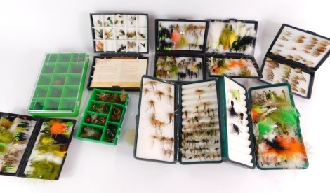 An assortment of trout fishing flies, to include lures, dry flies and wet flies, contained in nine fly cases.