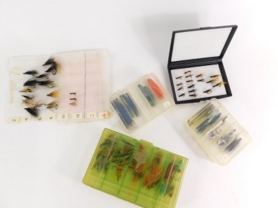A collection of salmon flies, to include traditional single and double flies, tube flies, and four fly cases. (1 tray)