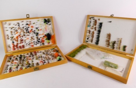 Two wooden Reservoir trout fly cases, containing a selection of traditional wet fly patterns, lures, etc.