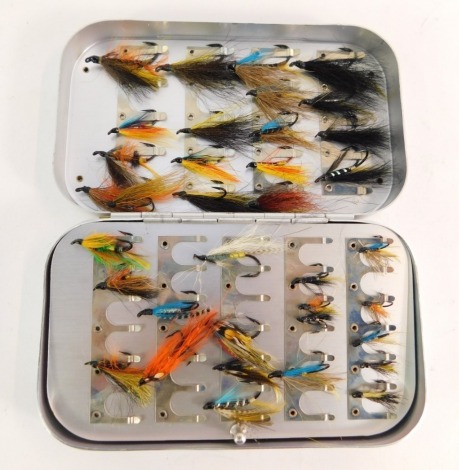 A Wheatley Silmalloy fly case, containing a selection of salmon flies.