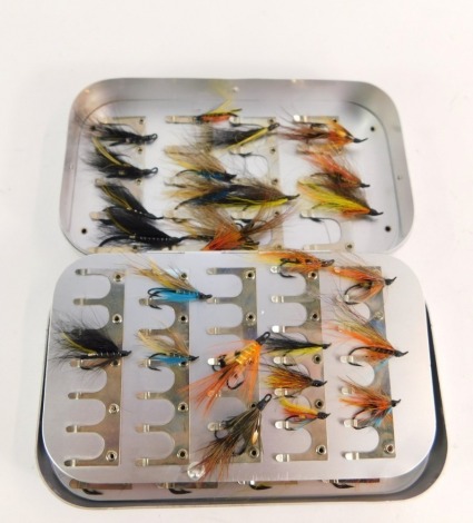 A Wheatley Silmalloy fly case, containing a selection of salmon flies.