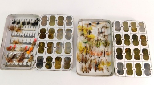 Two Okuma alloy fly boxes, each with enclosed compartments, and a selection of predominantly Mayflies and dry flies.