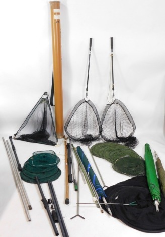 Two folding trout landing nets, and three keep nets, (two are illegal, display purposes only), together with fishing accessories, to include umbrellas and bank sticks, etc, wading stick, rod tube, landing net, etc. (a quantity)