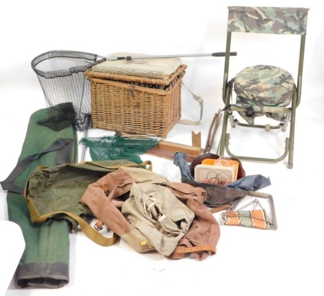 A group of fishing tackle, seats, canvas bags, landing nets, fly box, etc.