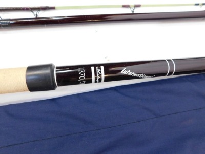 An Abu three piece fibre glass float fishing rod, and others, including a Kevin Ashurst 13ft carbon match rod, and four rod tubes. (8) - 4