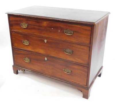 A late Georgian mahogany chest of three long drawers, raised on bracket feet, 85cm high, 108.5cm wide, 57cm deep.