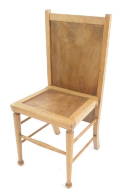 An Arts & Crafts style light beech chair or trouser press, with solid seat and back, raised on turned legs, united by spindles, 89cm high.