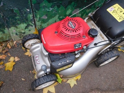 A Honda Izy petrol lawn mower, GCV135 with basket. - 2