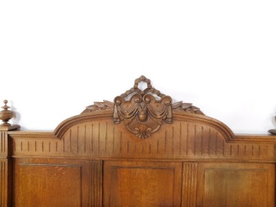 A Victorian oak double bed, with carved headboard, and wooden side planks. - 2