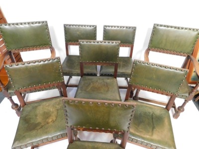 A set of eight Carolean revival oak dining chairs, with studded green leather backs and overstuffed seats, raised on turned legs, united by an H frame stretcher, comprising a pair of carvers and six single chairs. - 2