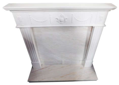 An Adam style marble and plaster fire surround, with vases and laurel swags, marbled back and hearth, 121cm wide.