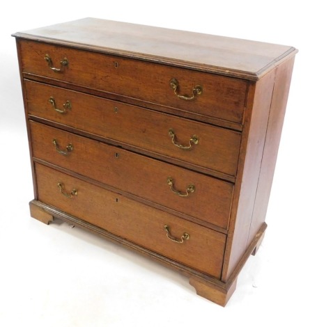 A George III oak chest, of four long graduated drawers, raised on bracket feet, cut down, 88cm high, 100cm wide, 46cm deep.