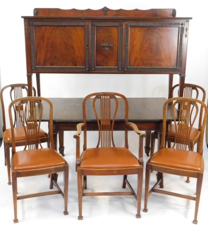 A Hepplewhite style mahogany dining suite, early 20thC, comprising a sideboard, with pair of doors, raised on channeled square legs on spade feet, 106cm high, 152cm wide, 53.5cm deep, together with a draw leaf dining table, with one additional leaf, 72cm 