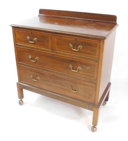 An Edwardian mahogany and boxwood lined inlaid chest, of two short over two long drawers, raised on stile feet, on later castors, 93cm high, 91cm wide, 48cm deep.