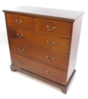 An Edwardian mahogany and barber's pole inlaid chest, of two short over three long graduated drawers, raised on bracket feet, 110cm high, 107cm wide, 47.5cm deep.