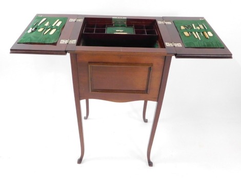 A Victorian mahogany sewing box, the hinge lidded top opening to reveal a fitted interior, with green watered silk, various sewing accoutrements, raised on slender square out swept legs, 70cm high, 39.5cm wide, 35cm deep.