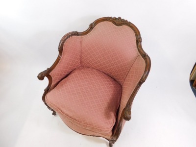 A French Louis XV style mahogany fauteuil, with foliate carving, upholstered in red patterned fabric, loose cushion seat, raised on cabriole legs. - 2