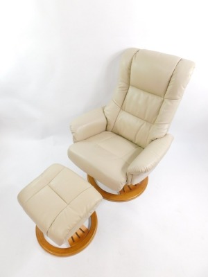 A Global Furniture Alliance cream leather Stressless revolving armchair, with footstool. (2) - 2