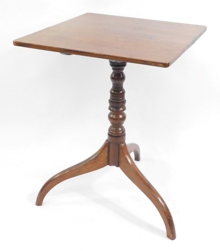 A George III mahogany tilt top occasional table, the rectangular top raised on a turned column above three scrolling legs, 70cm high, 52cm wide, 51cm deep.