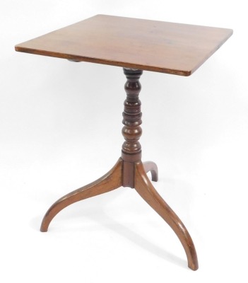 A George III mahogany tilt top occasional table, the rectangular top raised on a turned column above three scrolling legs, 70cm high, 52cm wide, 51cm deep.