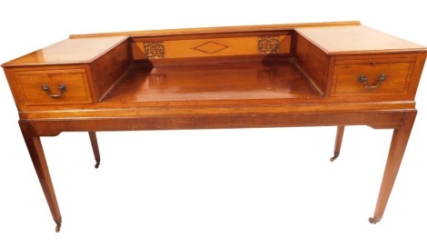 An 18thC cased square piano converted to a dressing table, with carved fret back and two drawers on tapered legs, terminating in castors, 90cm high, 168cm wide, 63cm deep.