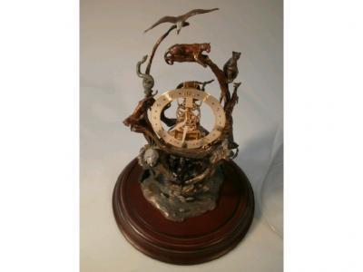 A Franklin Mint Guardians of the World skeleton clock in glass protective dome