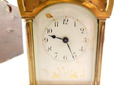 A late 19thC Duverdrey & Bloquel brass carriage timepiece, the white enamel dial painted in gilt with figures of swans and flowers, Arabic numerals, single barrel movement, the case of Islamic mosque form with crescent and star to the hood, impressed lion - 2