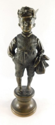 A Continental late 19thC bronze figure of an urchin boy, modelled standing holding a food sack, on a circular socle, unsigned, 37.5cm high.