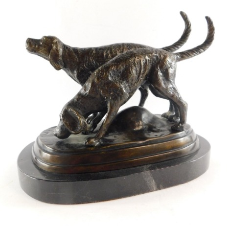 After P J Mene (French, 1810-1879). A pair of Pointers, bronze figure group, modelled on a naturalistic ground, on an oval veined black marble base, 22cm high, 26cm wide.