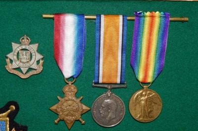 A collection of medal groups and records relating to the Pusterla family, including family trees, birth and marriage certificates, photographs and printed ephemera. The framed and glazed medal groups comprise a WWI Italian set of three, the Inter-Allied V - 3