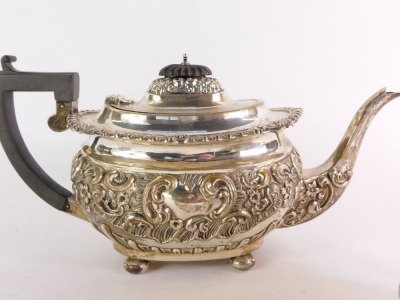 An Edward VII silver three piece tea set, embossed with rococo scrolls and flowers, comprising tea pot, milk jug and sugar bowl, George Nathan & Ridley Hayes, Chester 1902, 36oz gross. - 3