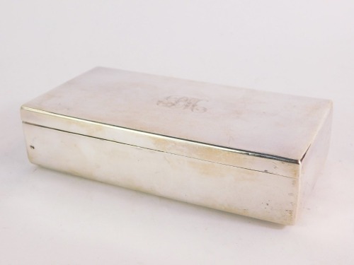 A Russian silver cigarette box, of rectangular section, monogram engraved, 84 zolotniki, bears maker's mark, St Petersburg, 15cm x 7cm, 8¾oz gross.