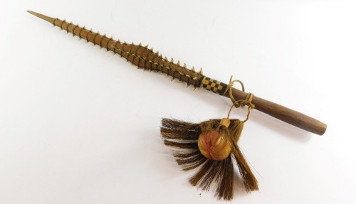 Tribal Art. A Gilbert Islands Tebutje dagger, with applied sharks teeth and hair drop ball, 78cm long.
