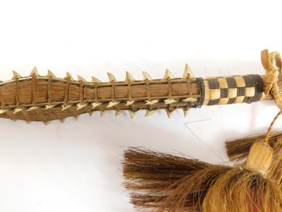 Tribal Art. A Gilbert Islands Tebutje dagger, with applied sharks teeth and hair drop ball, 78cm long. - 2