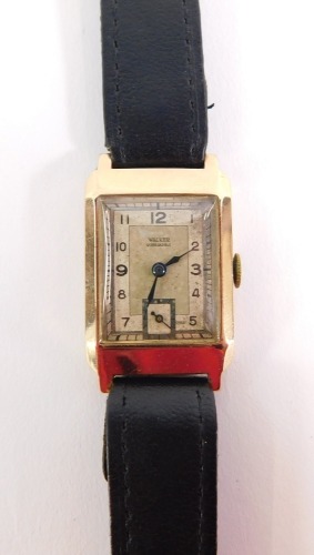 A 9ct gold cased James Walker gentleman's wristwatch, with a rectangular watch head, with seconds dial, on a black leather strap, the dial 3cm x 2cm, 16.8g all in, in fitted case.